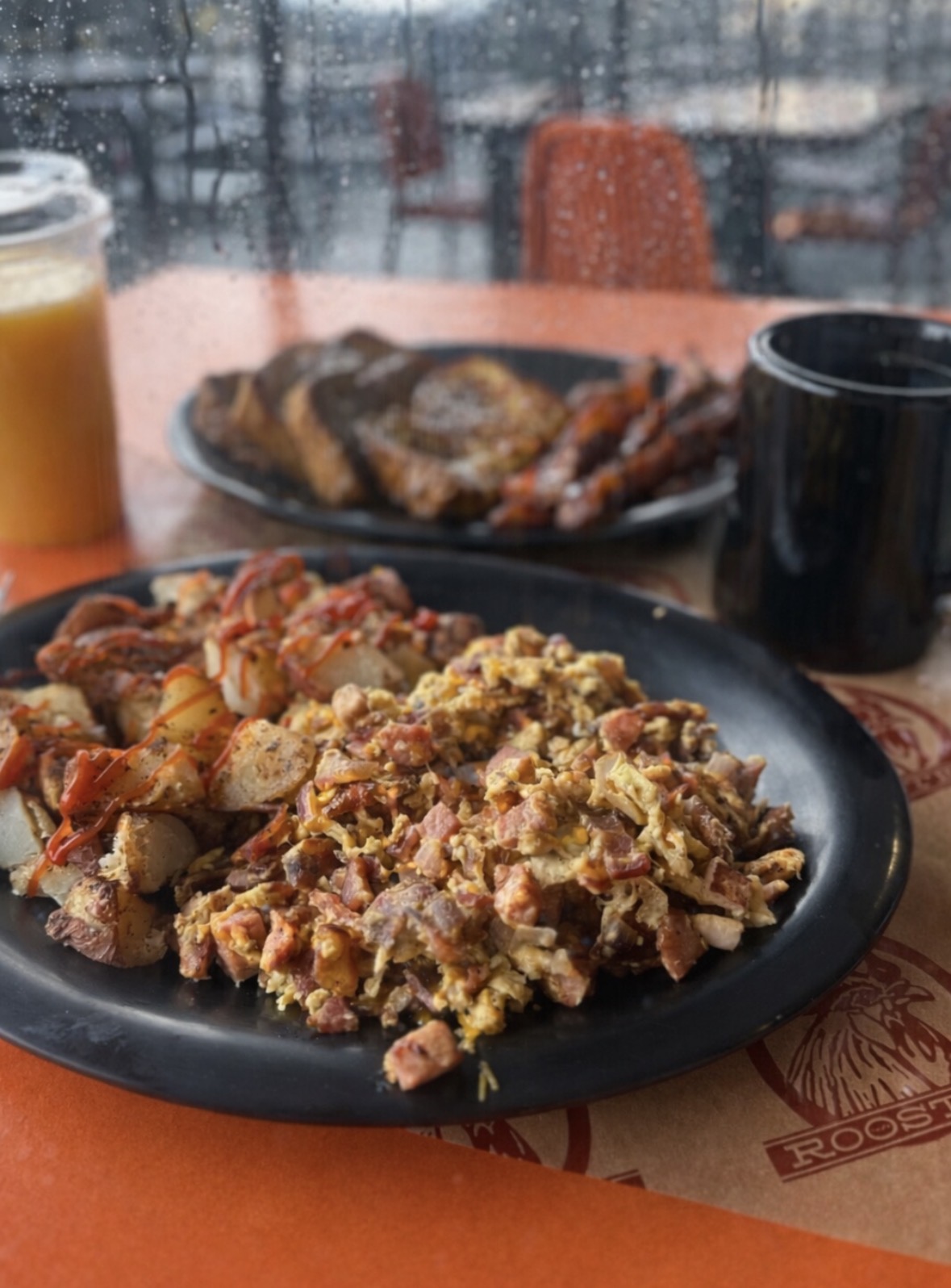 Corned beef hash with crispy potatoes and eggs at Rooster Cafe