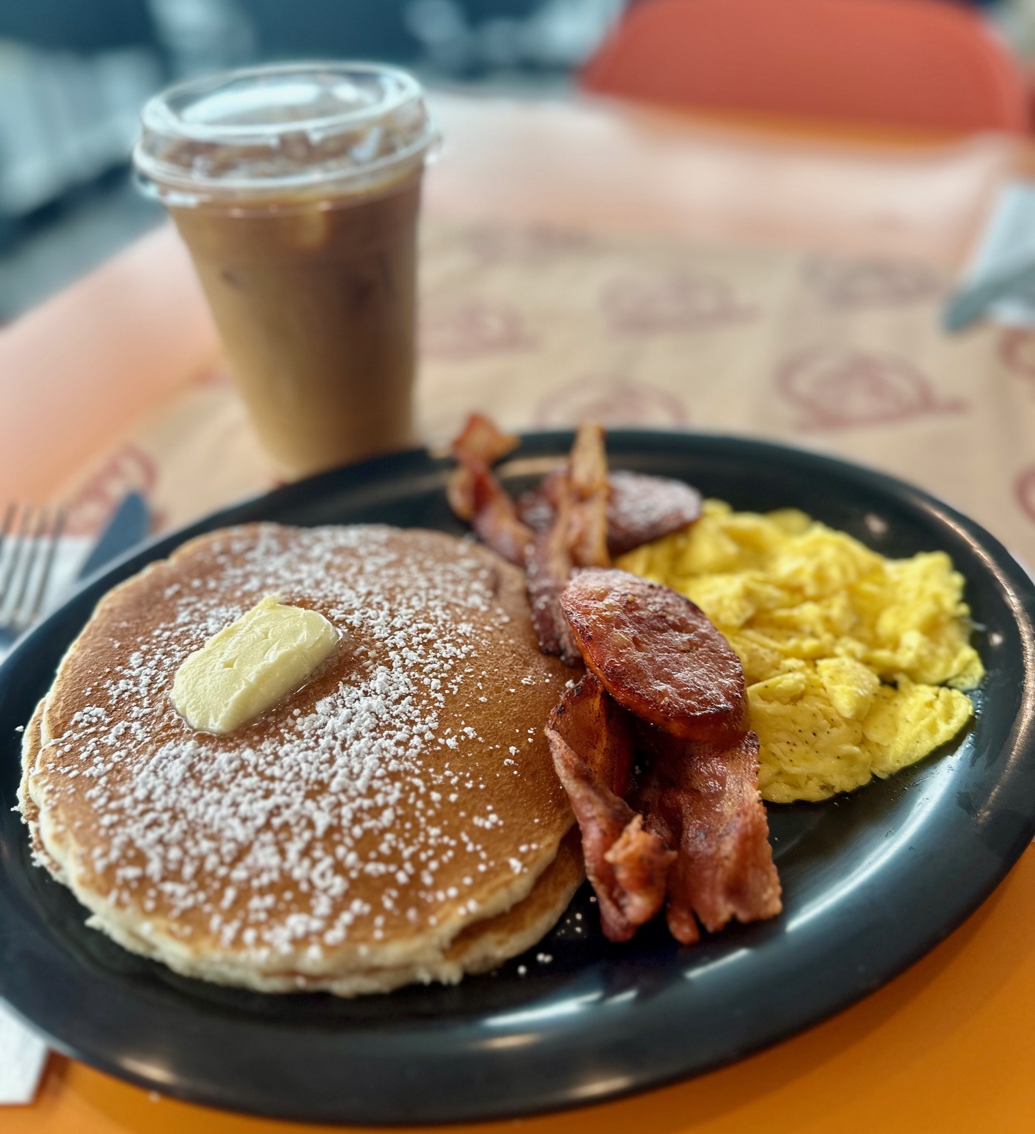 Buttermilk pancakes with eggs, bacon, and sausage at Rooster Cafe